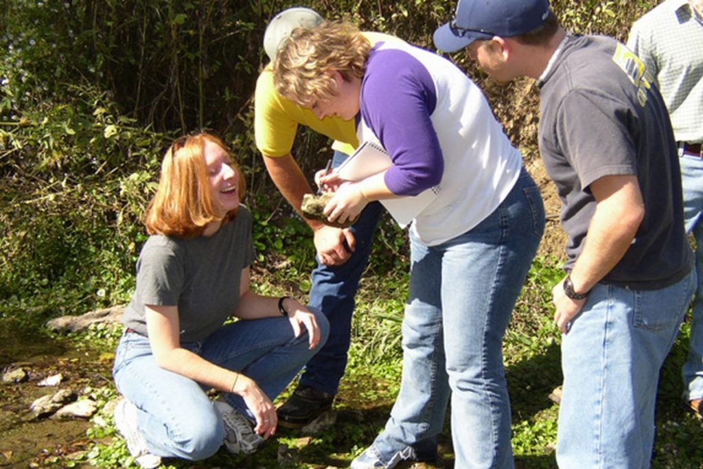 students at river