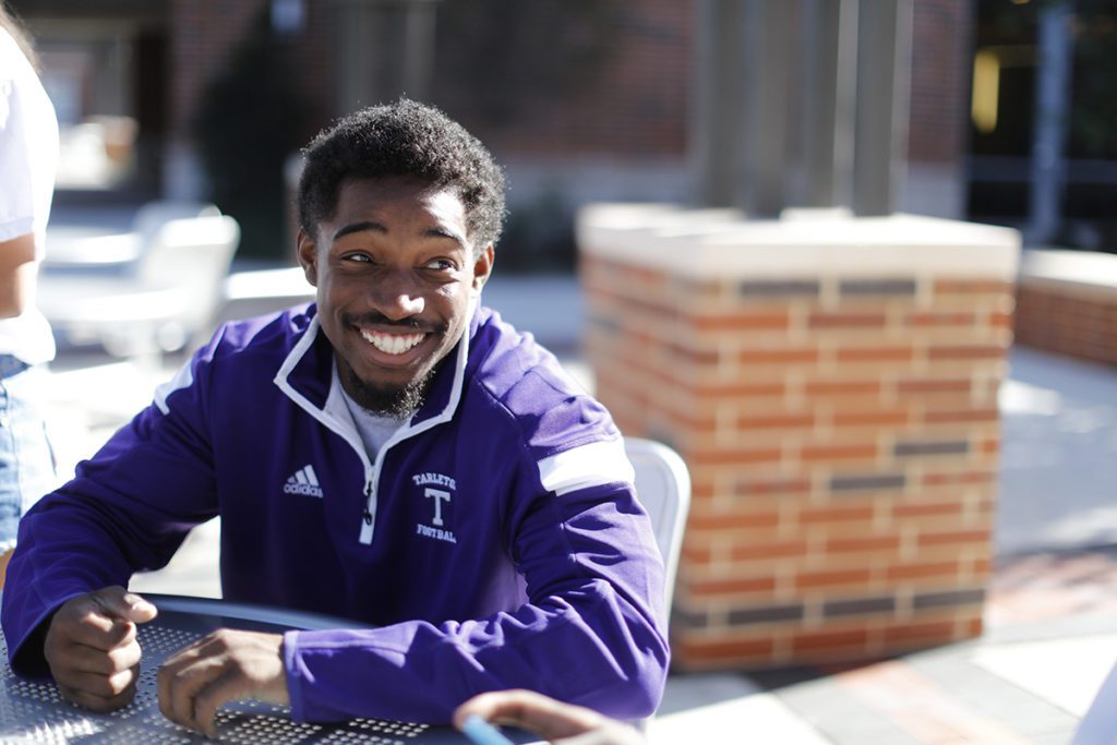 student outside table