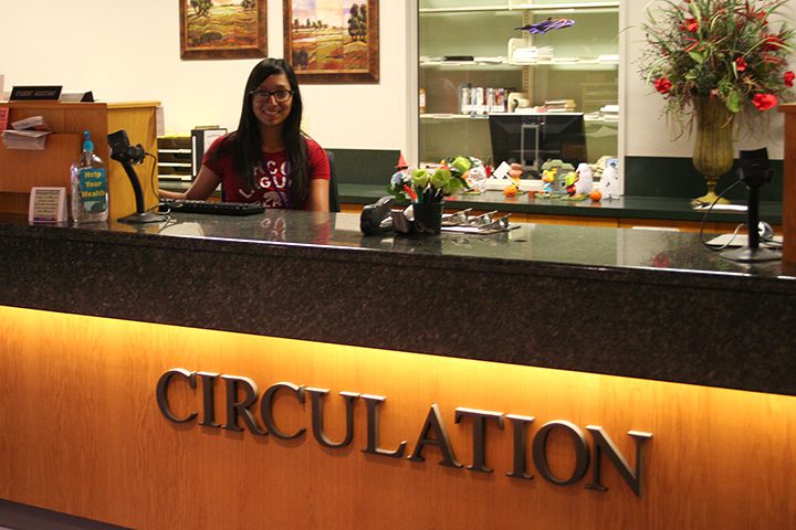 student at circulation desk