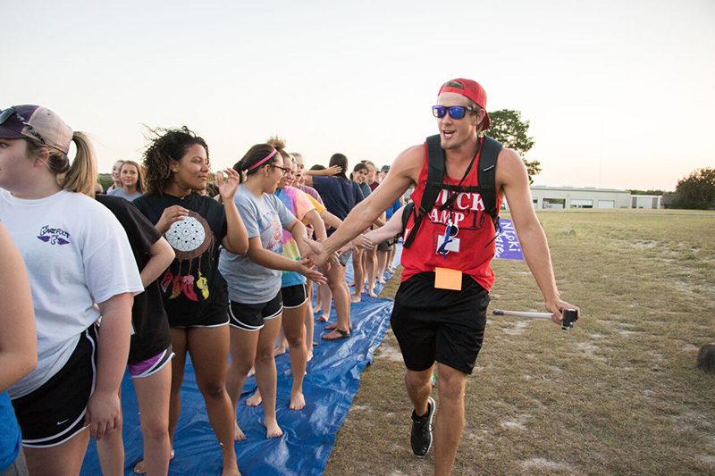 Duck camp worker pumping up students at duck camp