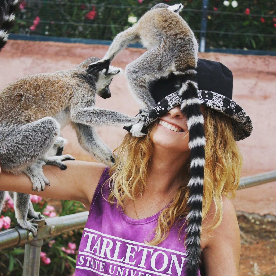 Tarleton student with two lemurs!